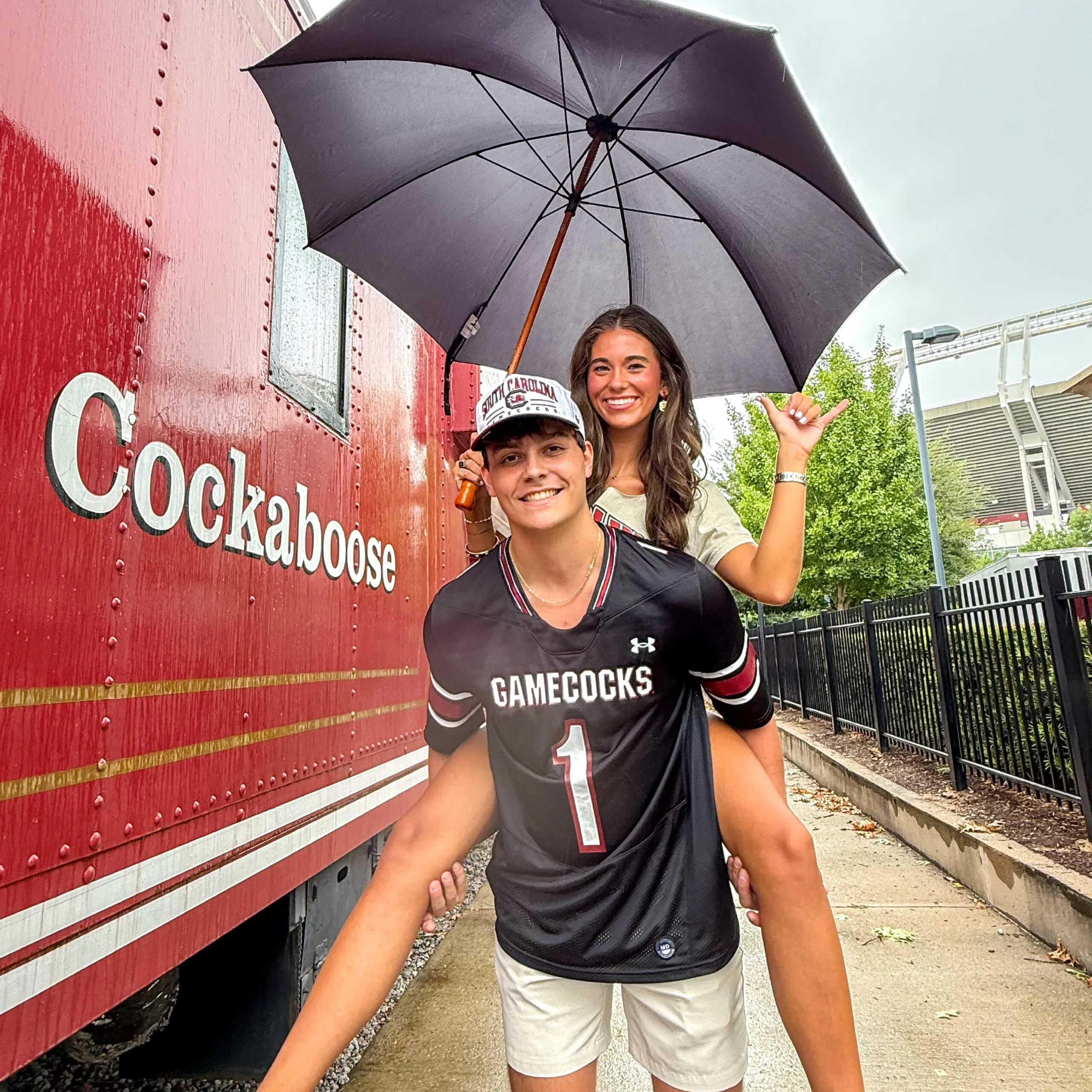 Man and woman wearing University of South Carolina apparel