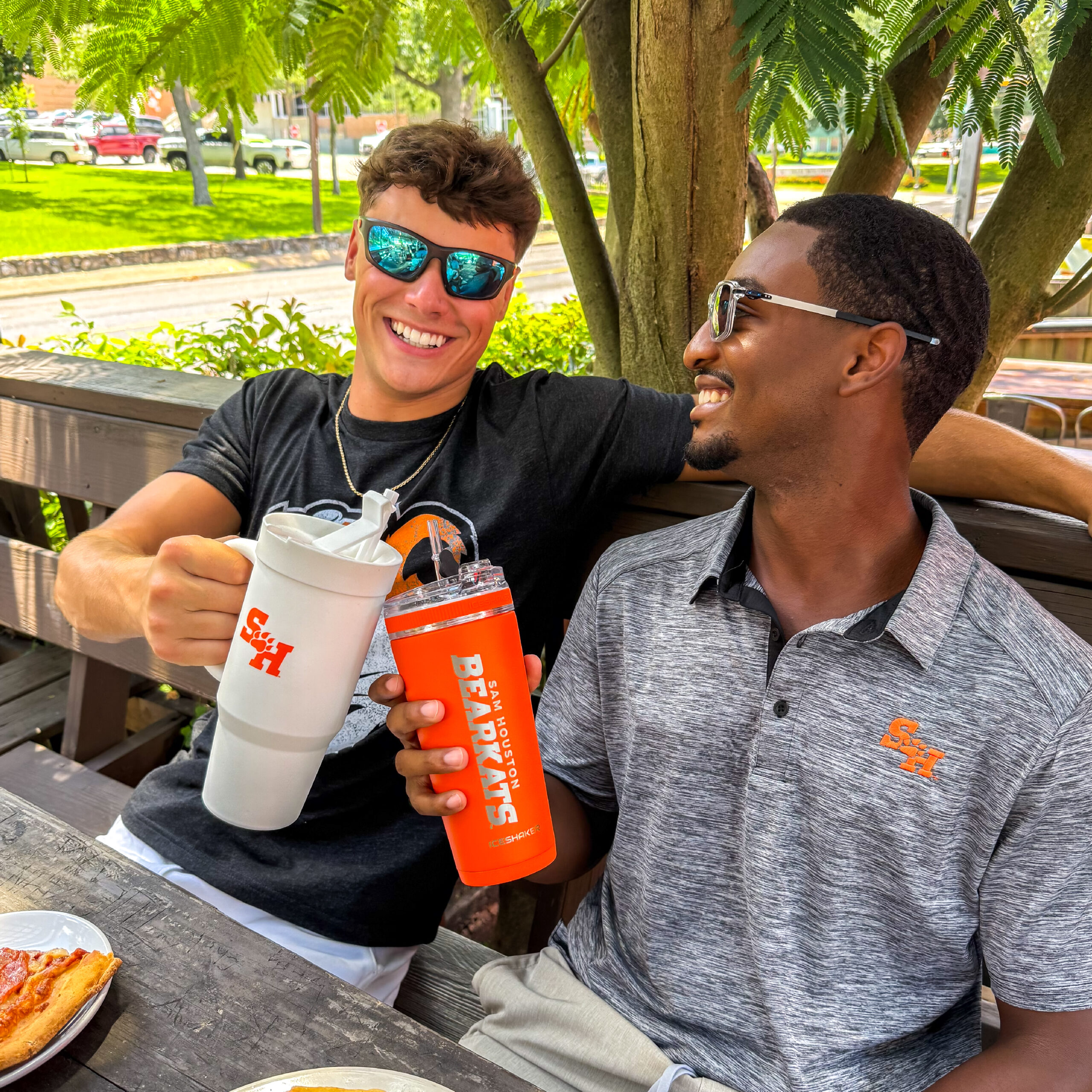 Two laughing men wearing Sam Houston State apparel