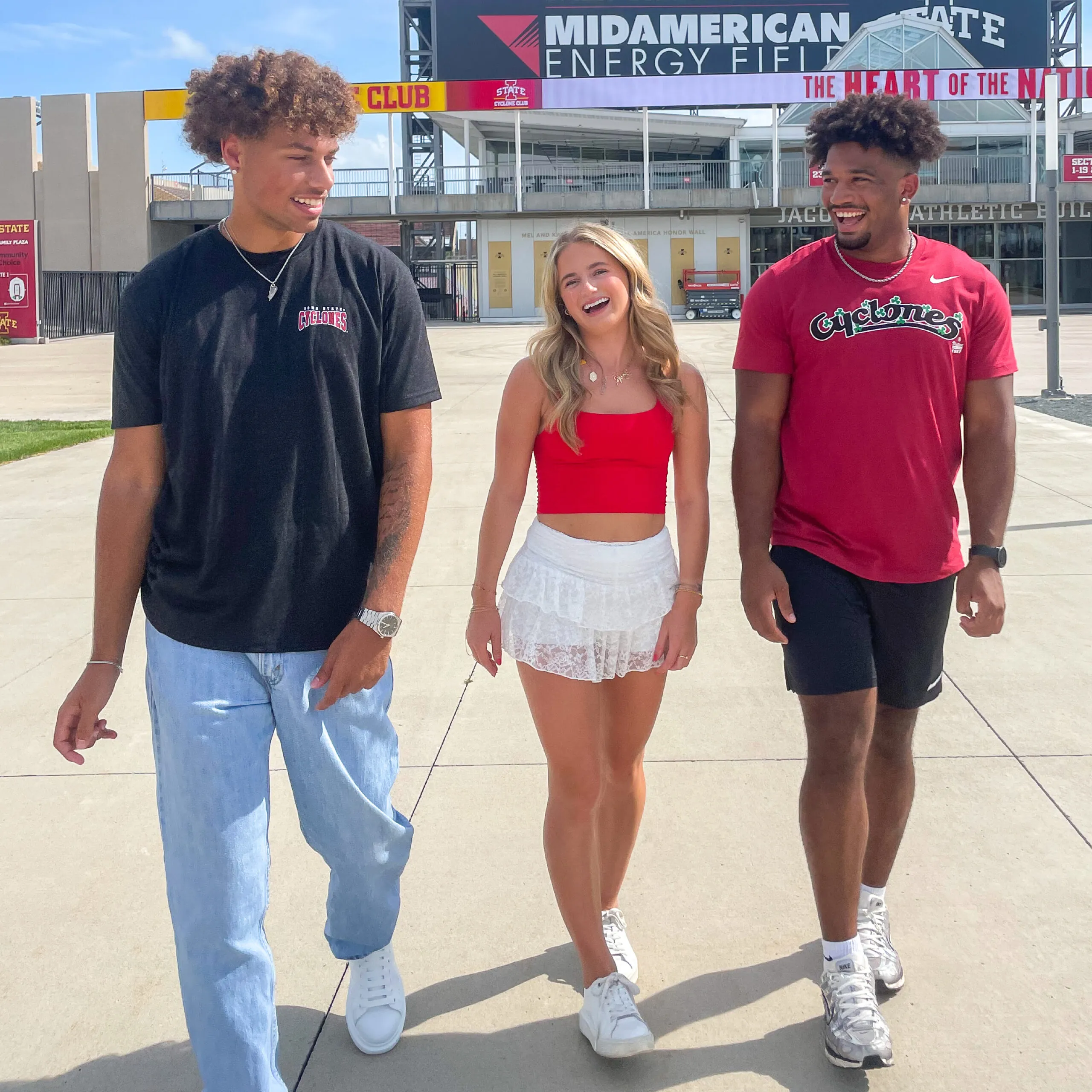 Group of people walking wearing Iowa State apparel