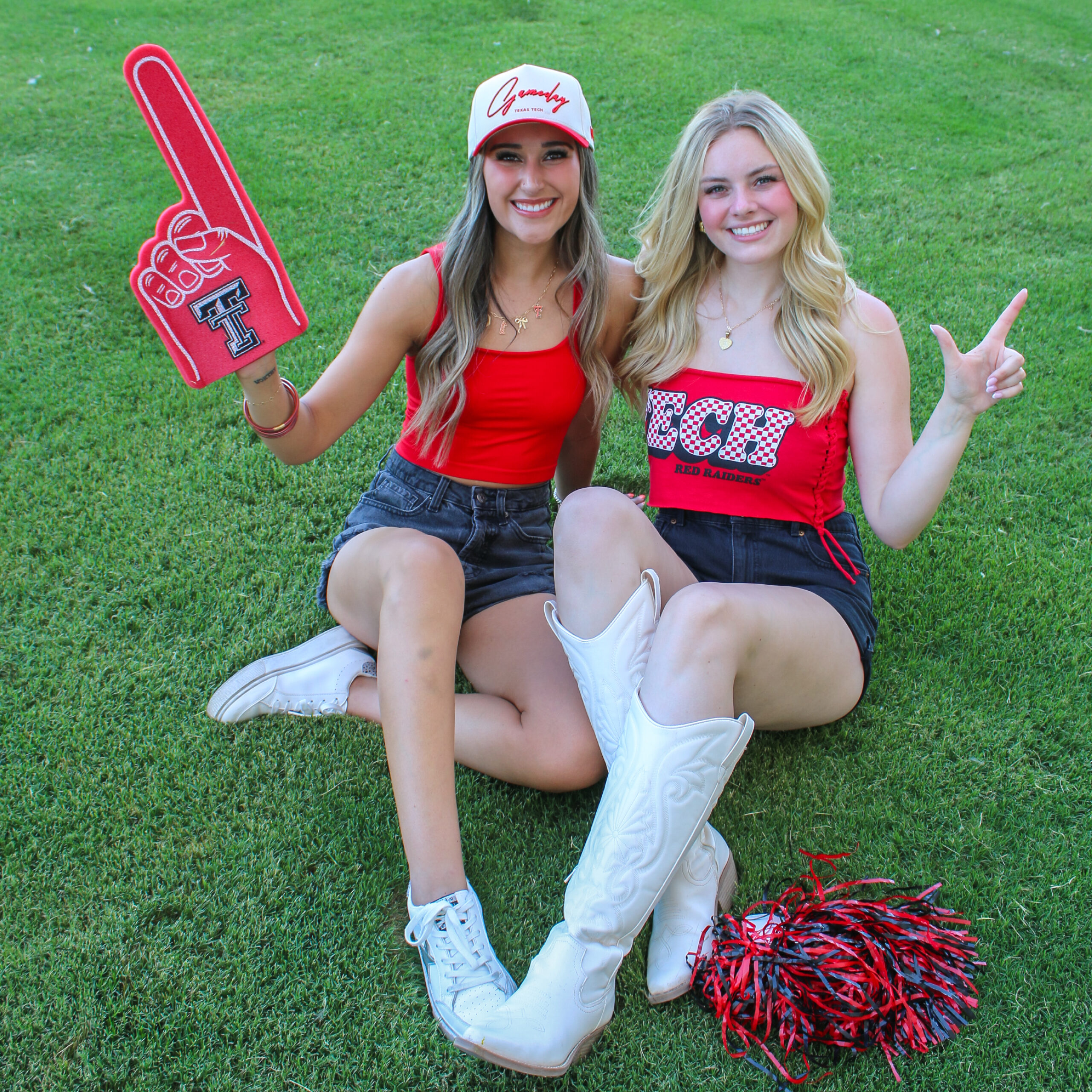 Two girls wearing Texas Tech apparel