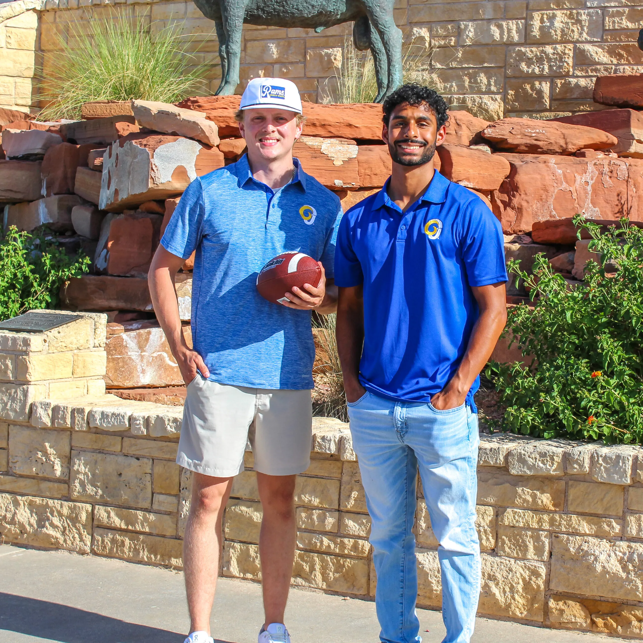 Two men wearing Angelo State apparel
