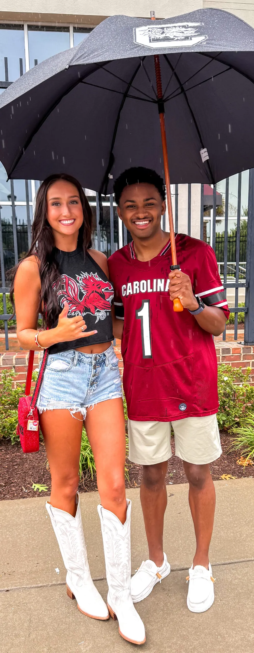 Two people wearing University of South Carolina apparel