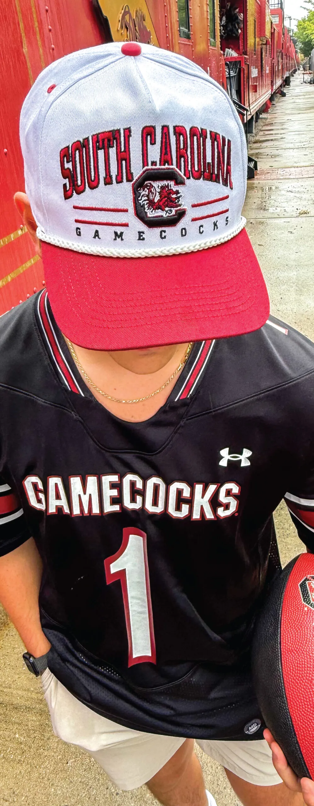 Man wearing University of South Carolina cap
